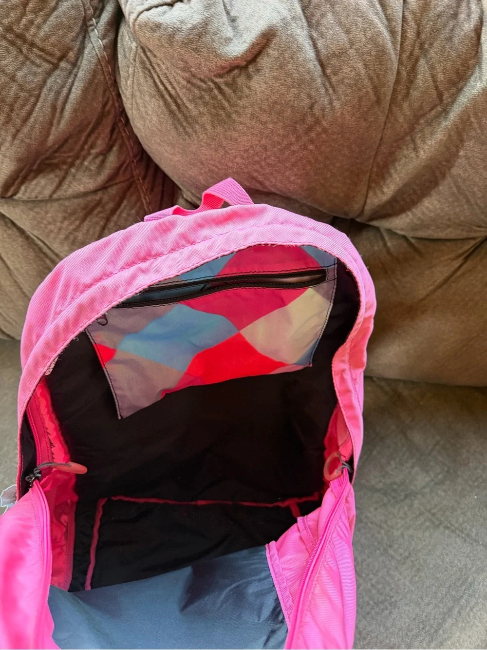 Pink and grey Nike backpack